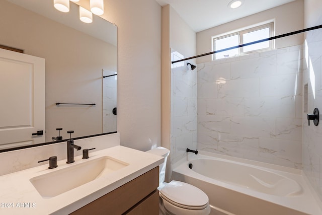 full bathroom with vanity, toilet, and tiled shower / bath