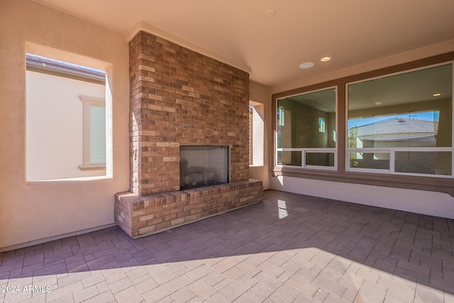 view of patio featuring an outdoor brick fireplace