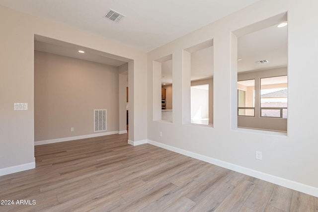 unfurnished room with light hardwood / wood-style flooring