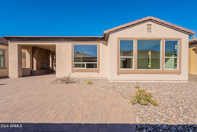 back of property featuring a patio