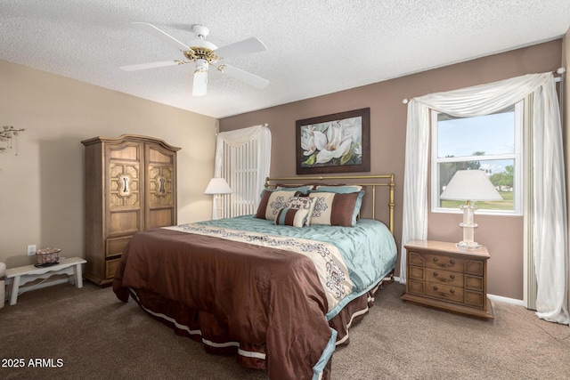 carpeted bedroom with ceiling fan and a textured ceiling