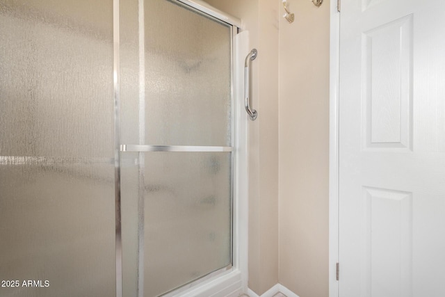 bathroom featuring an enclosed shower