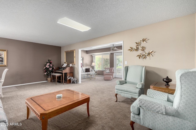 carpeted living room featuring a textured ceiling