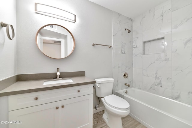 bathroom featuring shower / bathtub combination, vanity, and toilet