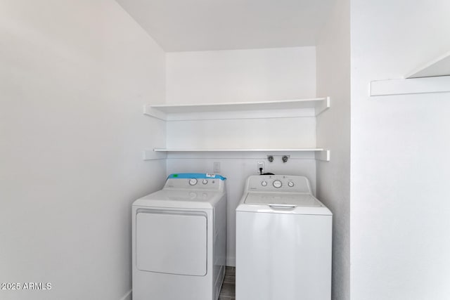 laundry area featuring washer and dryer and laundry area