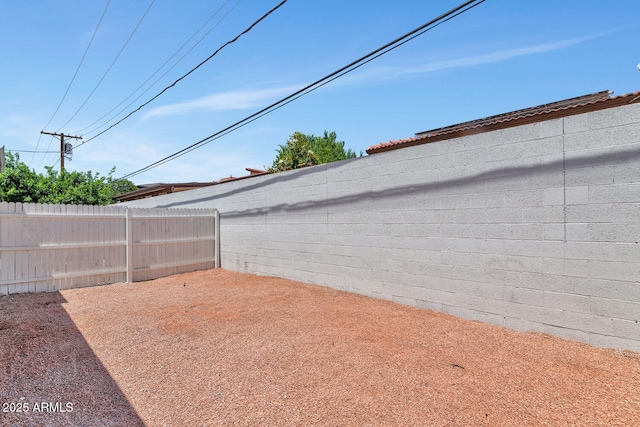 view of yard featuring a patio area and a fenced backyard