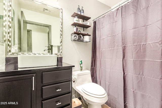 3032 W Red Fox Rd, Phoenix, AZ 85083 - bathroom featuring toilet, vanity, a textured wall, and a shower with shower curtain