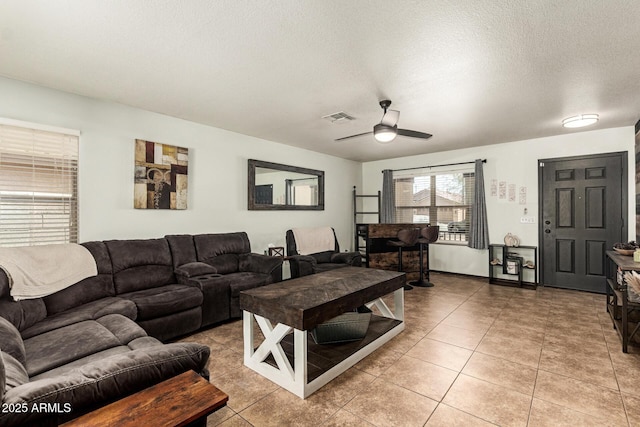 3032 W Red Fox Rd, Phoenix, AZ 85083 - living area with a textured ceiling, ceiling fan, and light tile patterned floors