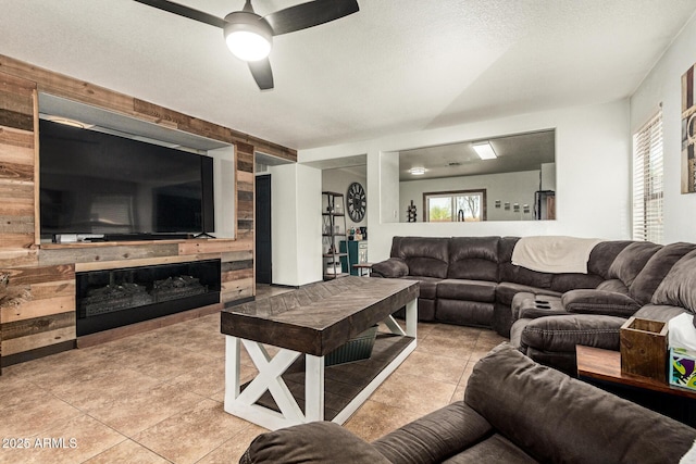 3032 W Red Fox Rd, Phoenix, AZ 85083 - living area featuring light tile patterned floors, a fireplace, a ceiling fan, and a textured ceiling