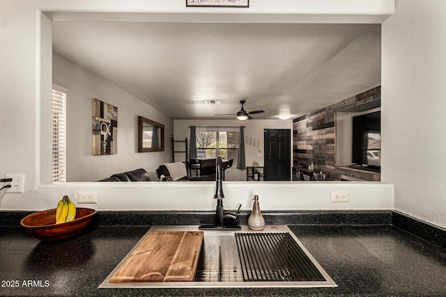 3032 W Red Fox Rd, Phoenix, AZ 85083 - kitchen featuring ceiling fan, dark countertops, a sink, and open floor plan