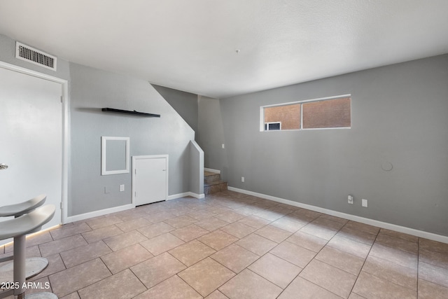 interior space with light tile patterned floors