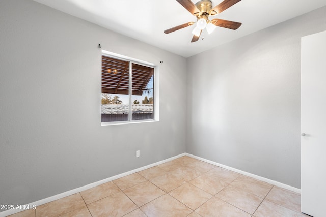 unfurnished room featuring ceiling fan and light tile patterned floors