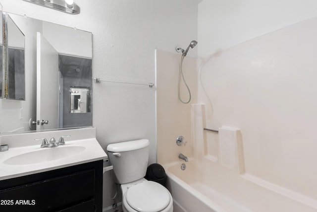 full bathroom featuring toilet, vanity, and  shower combination