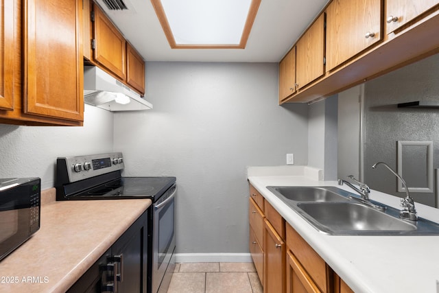 kitchen featuring sink, stainless steel range with electric cooktop, and light tile patterned flooring