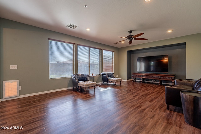 living room with ceiling fan and dark hardwood / wood-style floors