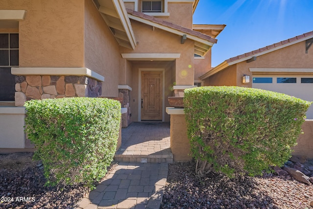 entrance to property featuring a garage