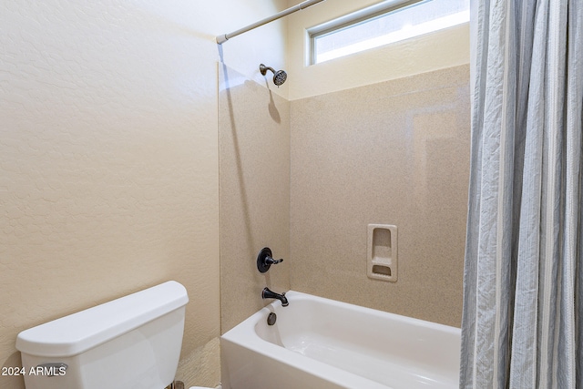 bathroom with toilet and shower / bathtub combination with curtain