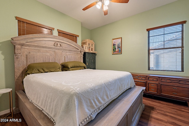 bedroom with dark wood-type flooring and ceiling fan