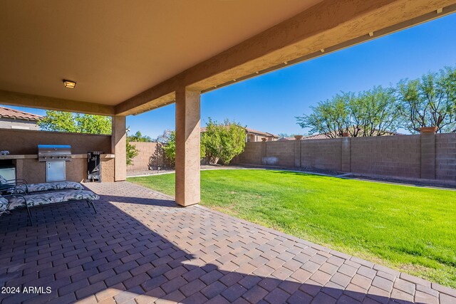 view of patio featuring exterior kitchen and area for grilling