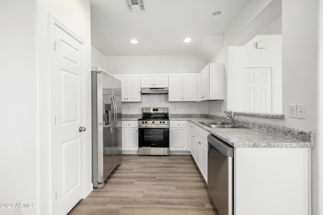 kitchen featuring sink, white cabinets, stainless steel appliances, and light hardwood / wood-style flooring