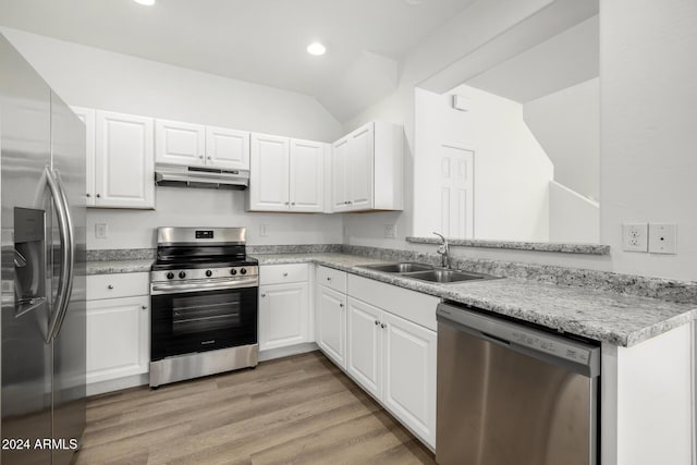 kitchen featuring white cabinetry, sink, kitchen peninsula, appliances with stainless steel finishes, and light wood-type flooring