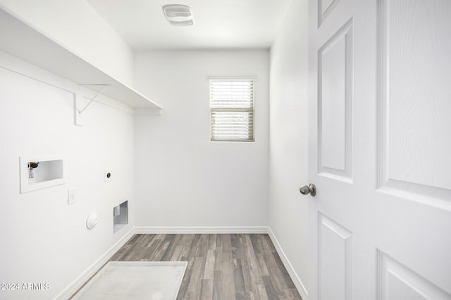 laundry area featuring hookup for an electric dryer, hardwood / wood-style floors, hookup for a gas dryer, and washer hookup