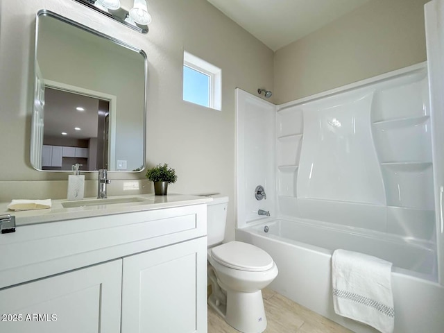 full bathroom with vanity, shower / bathtub combination, and toilet