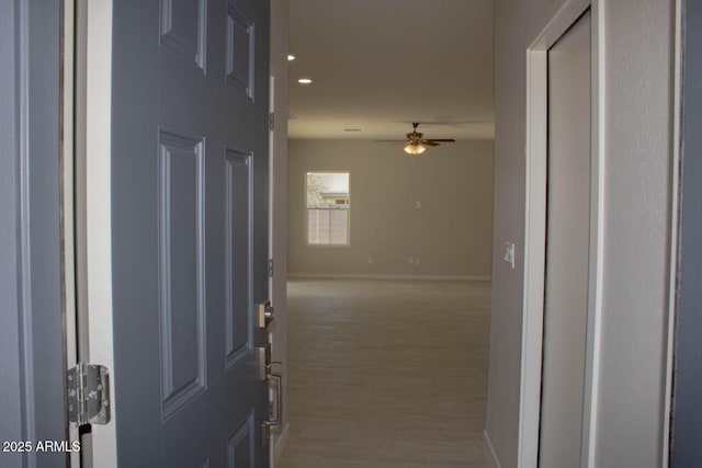 hall with light hardwood / wood-style floors