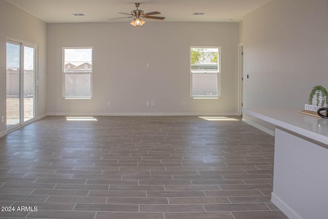 interior space with plenty of natural light and ceiling fan