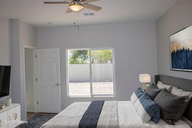 bedroom with multiple windows and ceiling fan