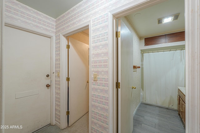 5228 E Des Moines St, Mesa, AZ 85205 - hallway with wallpapered walls and baseboards