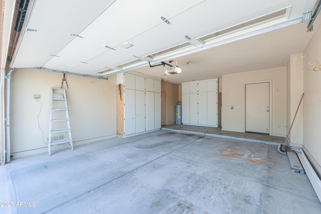 5228 E Des Moines St, Mesa, AZ 85205 - garage featuring a garage door opener and electric water heater