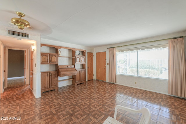 5228 E Des Moines St, Mesa, AZ 85205 - kitchen featuring brown cabinets, open shelves, baseboards, and a ceiling fan