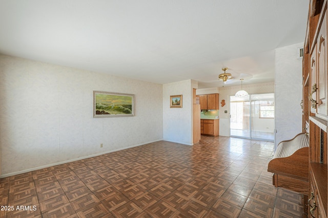5228 E Des Moines St, Mesa, AZ 85205 - unfurnished living room featuring wallpapered walls and baseboards