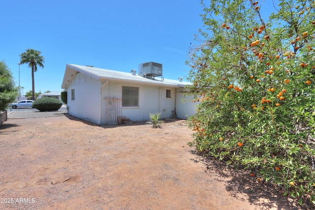 5228 E Des Moines St, Mesa, AZ 85205 - rear view of house featuring central AC unit and concrete block siding