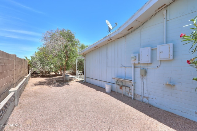 5228 E Des Moines St, Mesa, AZ 85205 - view of side of property featuring board and batten siding and a patio