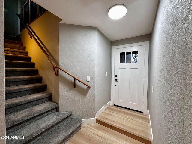 foyer with wood-type flooring