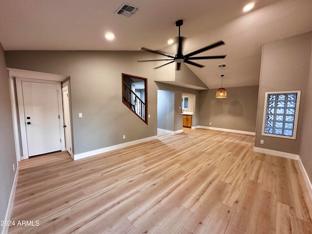 unfurnished living room with light hardwood / wood-style flooring, lofted ceiling, and ceiling fan