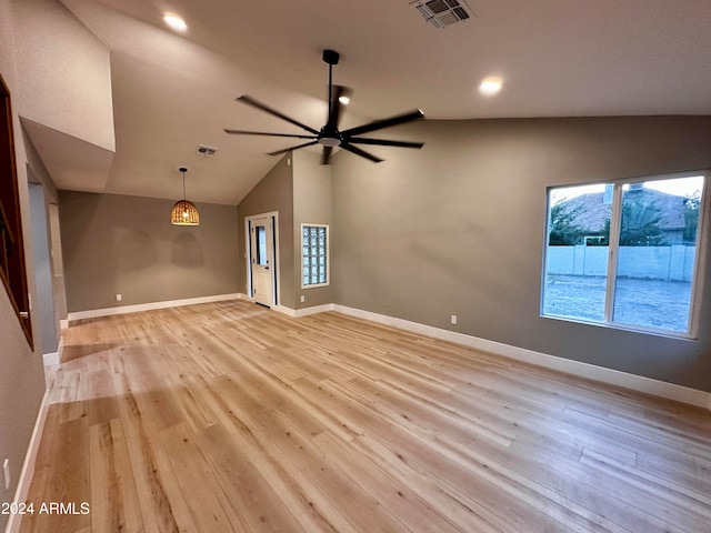 spare room featuring ceiling fan, vaulted ceiling, and light hardwood / wood-style floors