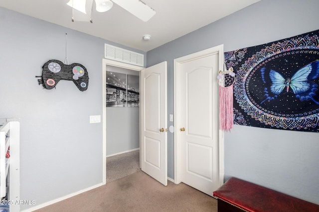 interior space featuring baseboards and carpet floors