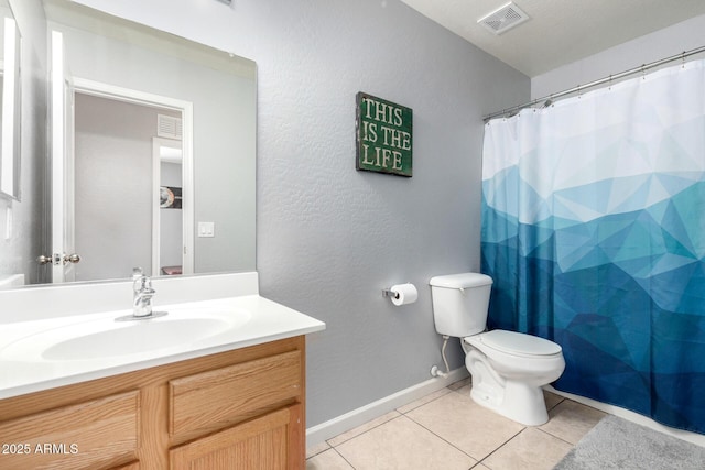 full bathroom featuring vanity, visible vents, baseboards, tile patterned flooring, and toilet