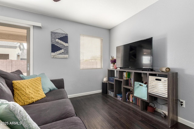 living room with baseboards and wood finished floors