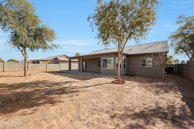 back of house with a patio and central air condition unit