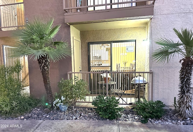 doorway to property featuring a balcony