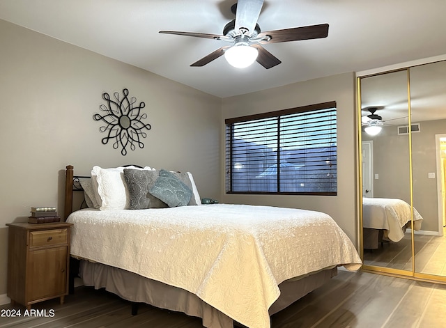 bedroom featuring hardwood / wood-style floors, a closet, and ceiling fan