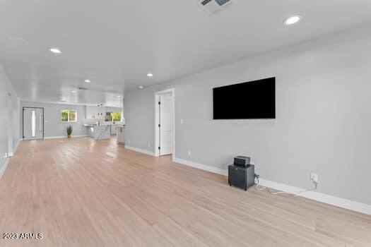 unfurnished living room with light hardwood / wood-style floors