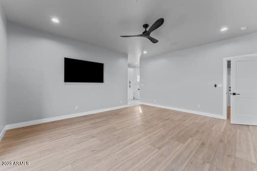 interior space featuring light hardwood / wood-style flooring and ceiling fan