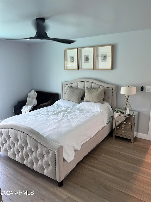 bedroom with hardwood / wood-style floors and ceiling fan