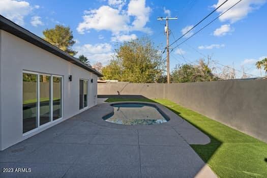 view of patio / terrace featuring a fenced in pool