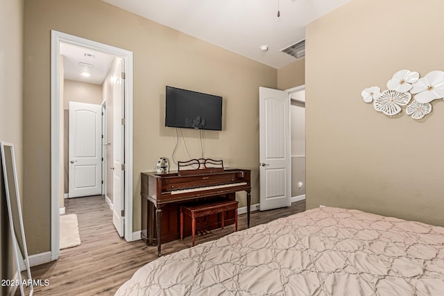 1367 S Country Club Dr Unit 1331, Mesa, AZ 85210 - bedroom featuring wood finished floors and baseboards
